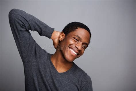 Cheerful Young African American Man Laughing With Hand Behind Head