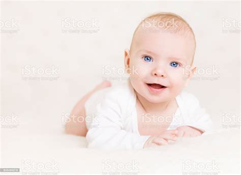 Baby Boy In White Happy Newborn Infant Kid Portrait Cute Child Lying On
