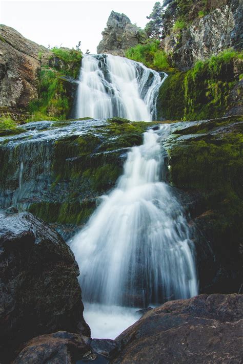 Waterfall Falling Into Rocky Ravine · Free Stock Photo
