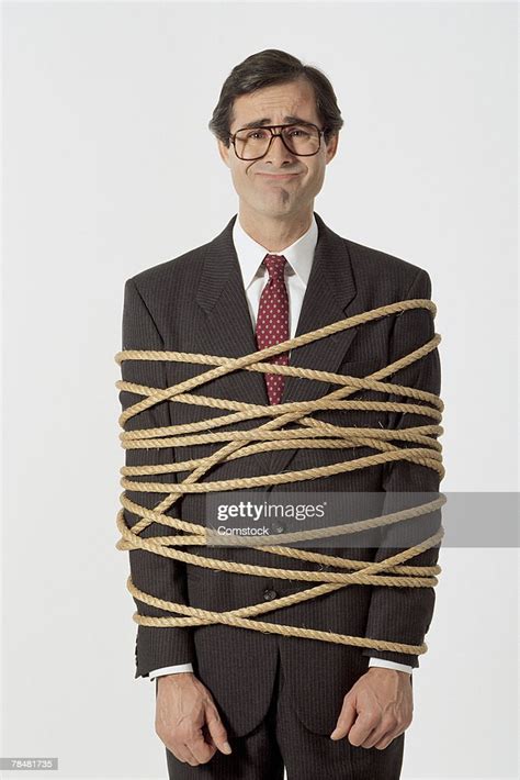 Businessman Tied Up With Rope High Res Stock Photo Getty Images