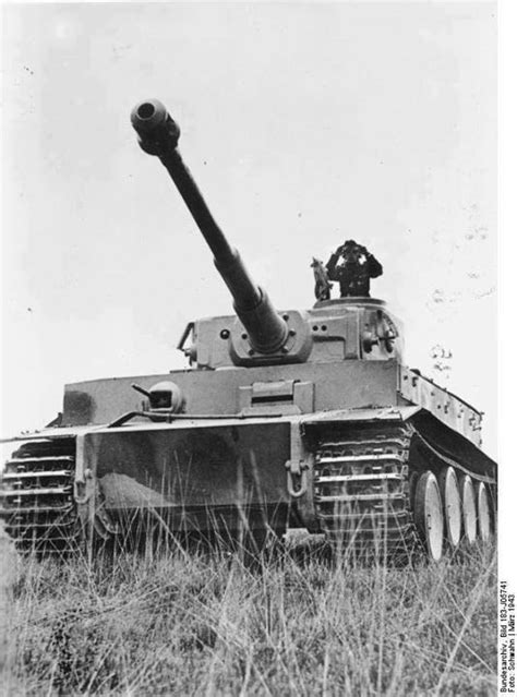 A German Tank Commander Surveying The Field Atop His Tiger I Heavy Tank