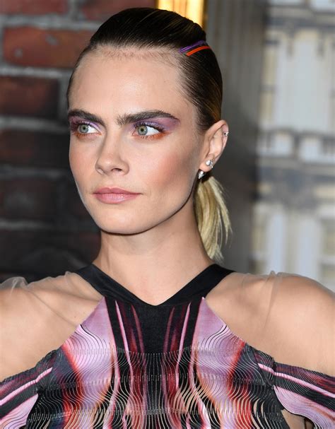 cara delevingne matches her makeup with a striking hair statement at the carnival row premiere