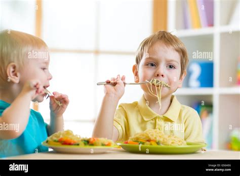 Child Eating Healthy Food In Home Or Daycare Center Stock Photo Alamy