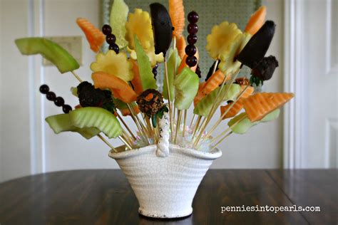 Celebrate your loved one with an edible arrangement featuring a beautiful array of fruit blooms. DIY Edible Arrangement - Pennies into Pearls