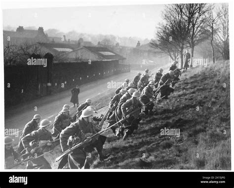 YUGOSLAV ARMY UNIT IN TRAINING - Jugoslav recruits storming an'enemy