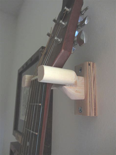 With a guitar hanger, you get to display your instrument and you also protect it from damage. Frugal For You: DIY Guitar Wall Mount From Wood Scraps!