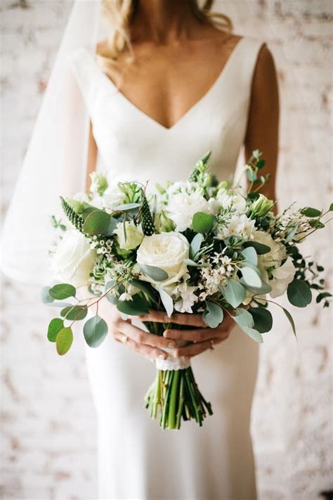 Picture Of A White Wedding Bouquet With Peonies And Roses