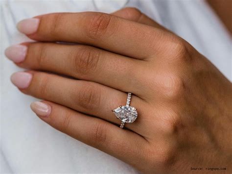 decoding the beauty and value of a 4 ct pear shaped diamond ring and understanding ring sizing