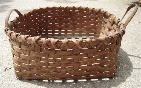 Each team tries to score by tossing the ball through the opponent's goal, an elevated horizontal hoop and net called a basket. Early 20th Century Reed Basket from ...