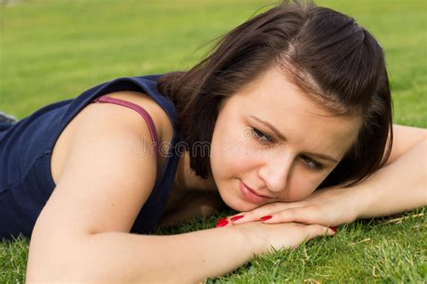 Portrait Of Young Brunette Girl Lying On A Grass Stock Image Image Of