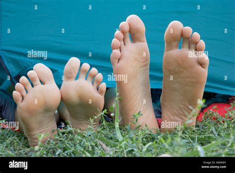 Two People S Feet Sticking Out Of Tent Door Stock Photo Alamy