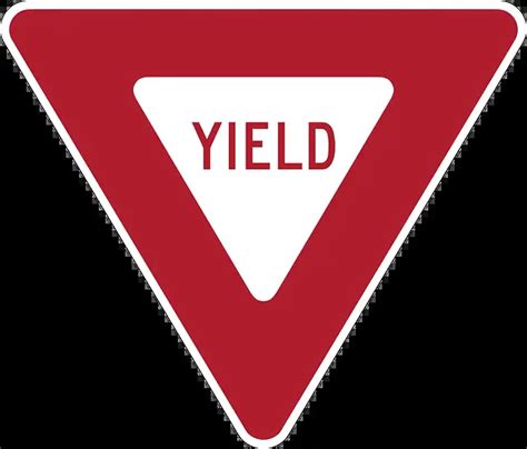 A Red And White Triangular Sign At An Intersection Means Answered
