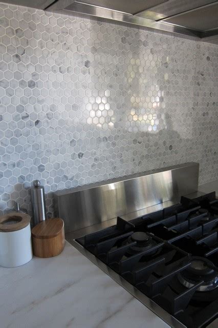 I wanted an asymmetrical modern look and used the hexagons to. Hexagon marble backsplash - Modern - Kitchen - houston