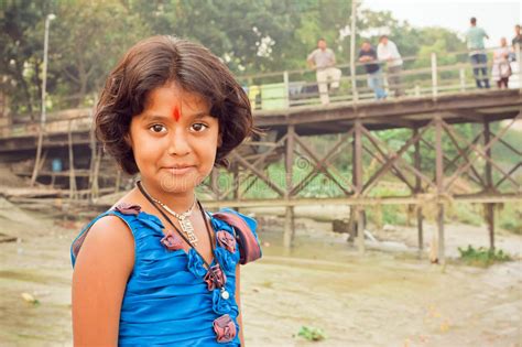 Girl With Beautiful Eyes And Tilak Sign Playing In Indian Village