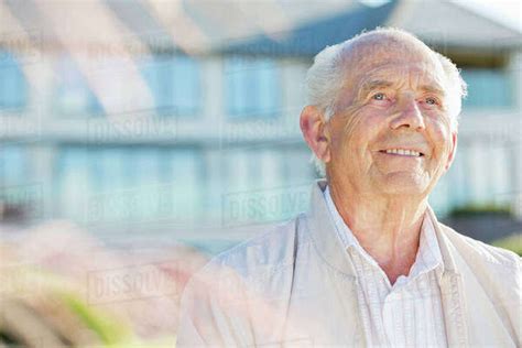 Smiling Older Man Standing Outdoors Stock Photo Dissolve