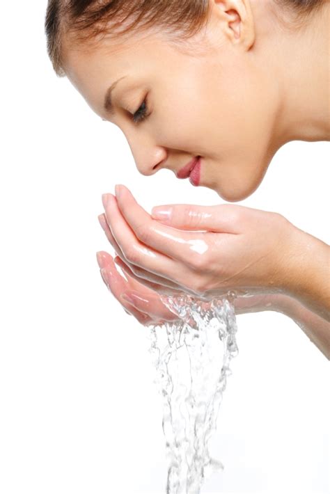 Female Washing Her Face With Water Eudelo