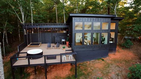 Black Board And Batten Siding Covers The Exterior Of This Cabin In The
