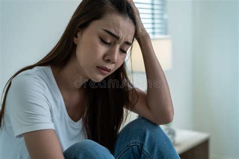 Asian Beautiful Depression Girl Crying In Tears Sit On Bed In Bedroom