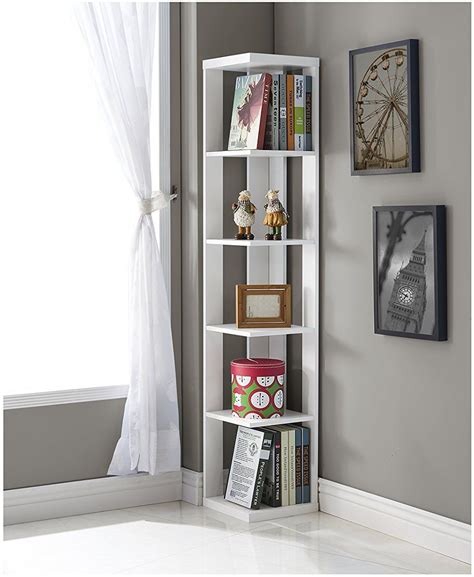 A Tall White Book Shelf With Many Books On Its Sides In Front Of A Window