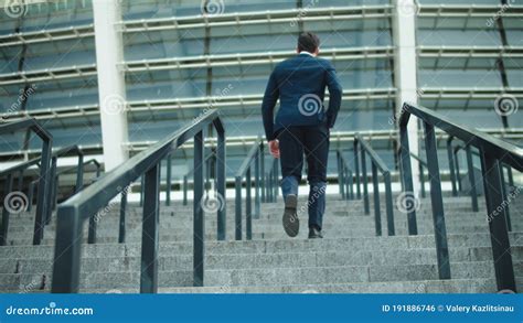Back View Stylish Man Going Upstairs In Suit At Street Successful