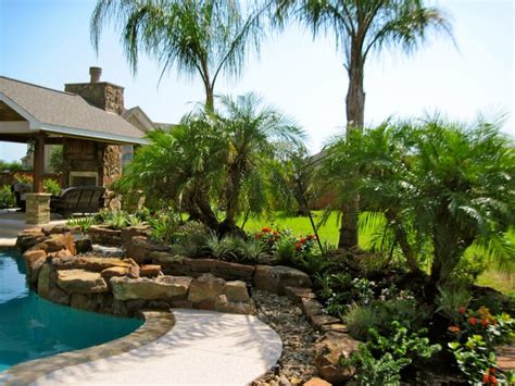 One way to add life to your pool area is to install large pots or boxes of flowers. Backyard pool landscape - Tropical - Landscape - Houston ...