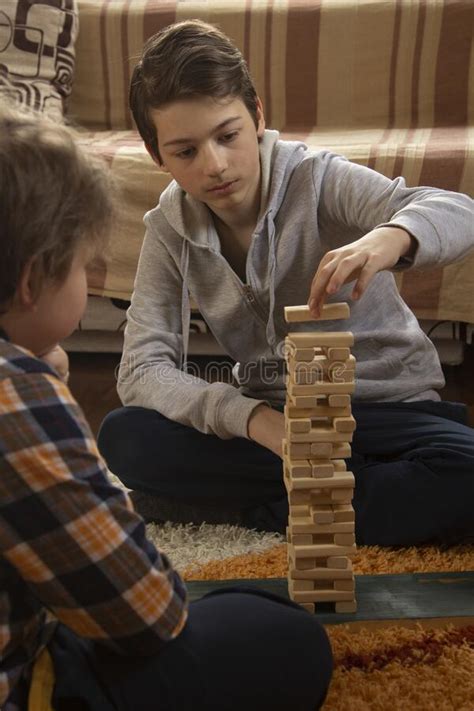Boy Play Jenga Game Together Children Playing At Home Interior Stock