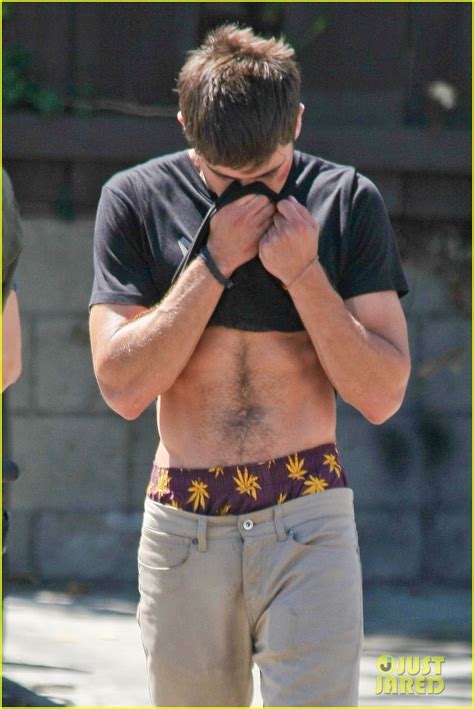 Zac Efron Lifts Up His Shirt And Gives Us The T Of His Abs Photo
