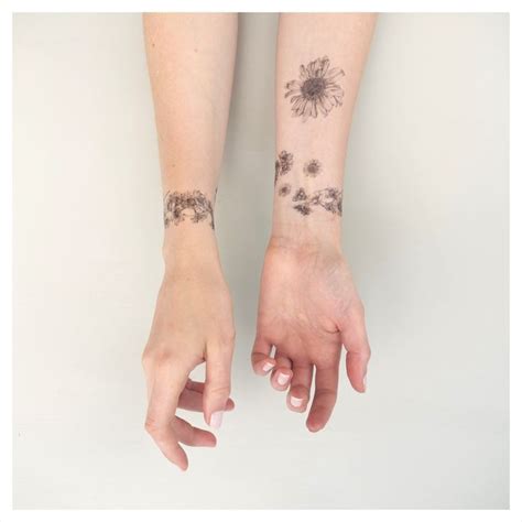 The wrist is the perfect place to get a single daisy tattoo. Related image | Daisy chain tattoo, Chain tattoo, Tattoo kits