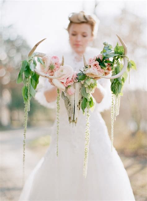Bridal bouquet for a rustic fall wedding, made with flowers, cattails, wheat, pine cones and a deer antler. 18 Ways to Use Deer Antler for Your Rustic Wedding - ChicWedd