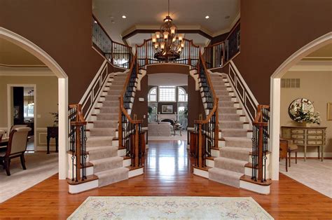 Luxury home plans contemporary curved double staircase for sale. Rutledge | Williamsburg Homes | Elegant entryway, Double ...