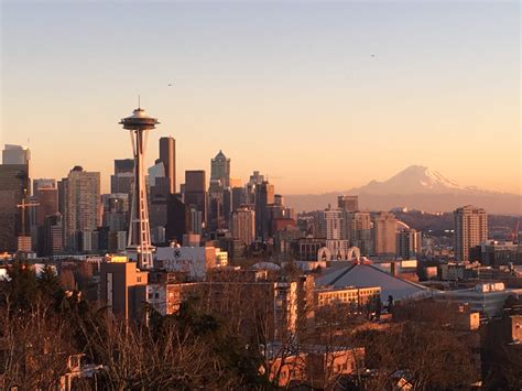 Space Needle and Mount Rainier in the distance during sunset in Kerry
