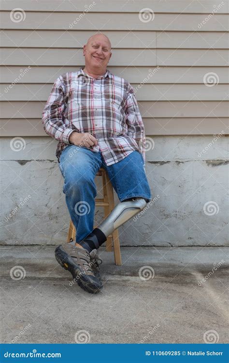 Smiling Amputee Man Prosthetic Leg Forward Seated Stock Image Image