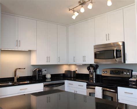 Kitchen cabinet hardware kitchen cabinets in bathroom kitchen doors cupboard open kitchen kitchen pantry kitchen reno kitchen backsplash diy kitchen. White Contemporary Kitchen with Brushed Nickel Hardware ...