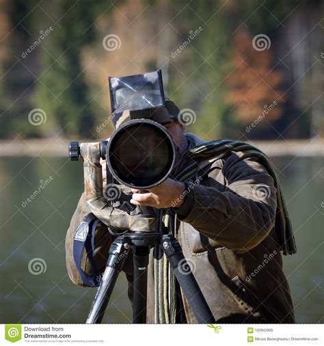 Wildlife Photographer Outdoor In Action Stock Photo