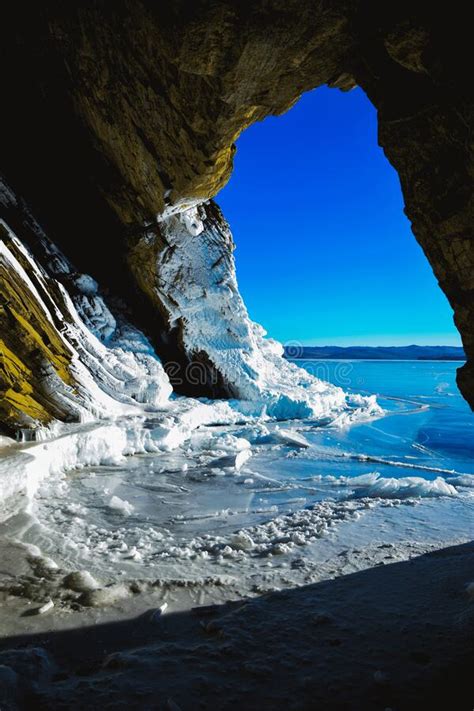 Baikal Lake In The Winter View From The Ice Grotto In The Coastal