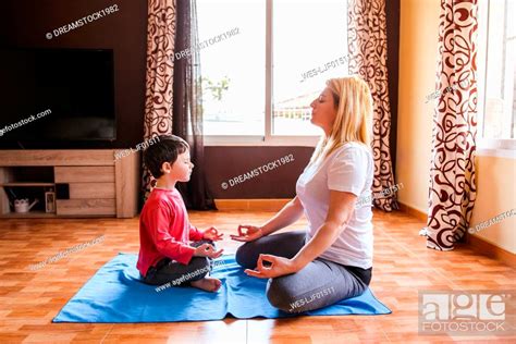 Mother And Son Doing Yoga Together At Home Stock Photo Picture And Royalty Free Image Pic