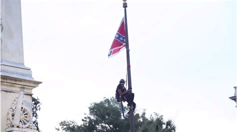 Activist Pulls Down Confederate Flag At South Carolina Statehouse