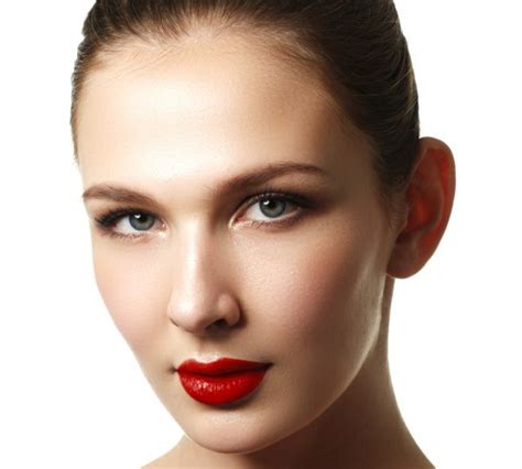 Close Up View Of Female Wearing Red Lipstick With Mouth Open Over White