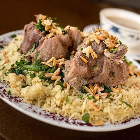 Mansaf Is A Traditional Jordanian Dish Made Of Lamb Cooked In A Sauce Of Fermented Dried Yogurt