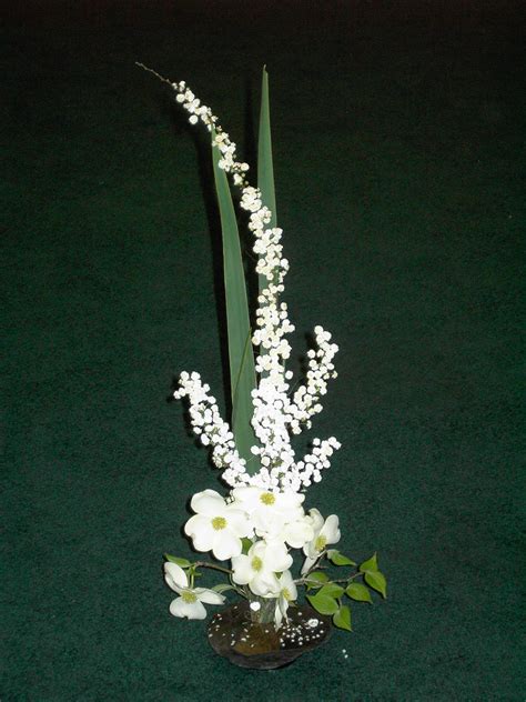Ikebana flower arrangements are all about creating a triangular composition that features three floral elements of varying heights. Vertical Flower Arrangement by Carol Booth and Dot Nelson ...