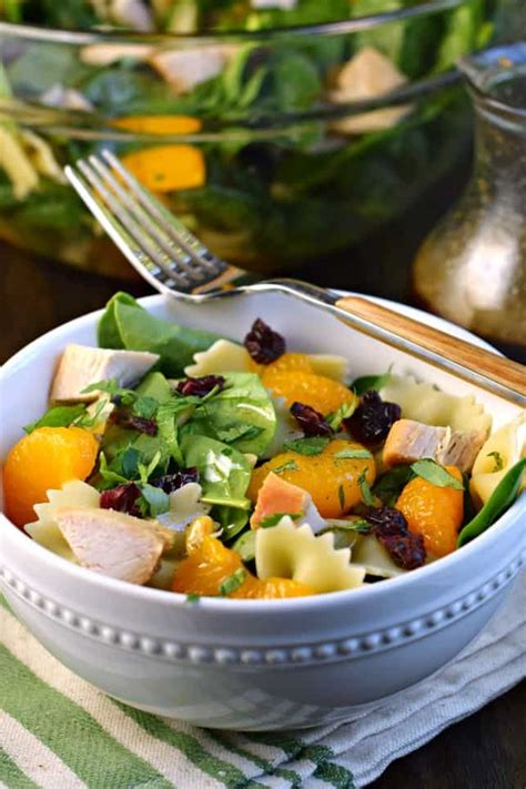 In a large bowl toss together pasta, spinach, raisins, nuts, mandarin oranges, and cilantro. Mandarin Chicken Pasta Spinach Salad with Teriyaki ...