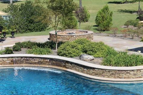 Often built with rocks or boulders (real and faux) as part of naturalistic pool design, waterfalls are one of the most popular water features when paired with swimming pools. Custom Gunite with Stacked Stone, Sheer Descent Waterfall ...