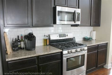 Backsplash tile decorative tile shells pearls board house painting ideas products. Home Tour | Backsplash with dark cabinets, Gray subway tile backsplash, Dark kitchen cabinets