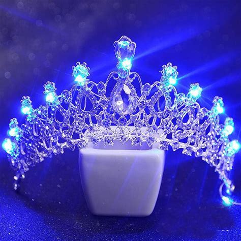 A Tiara With Blue Lights On It Sitting In Front Of A Dark Background