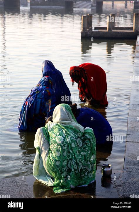 Indian Females Performing Morning Daily Ablutions At Ramkund Bathing Tank Nasik Maharashtra
