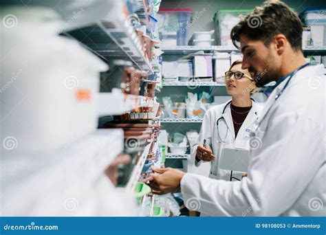 Pharmacists Checking Inventory At Hospital Pharmacy Stock Image Image