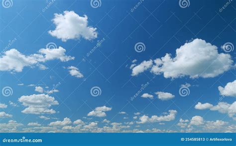 Clouds Running Across The Blue Sky White Puffy And Fluffy Clouds On