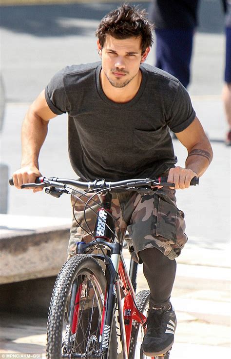 Taylor Lautner Displays Sporty Side And Toned Six Pack While Leaping