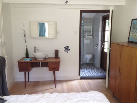 Hello, i recently converted my living room into a second bedroom, to rent out and i was thinking of adding a sink to cut down on bathroom time and to make it easier for guests. Beautiful vintage desk turned into bedroom sink and vanity ...