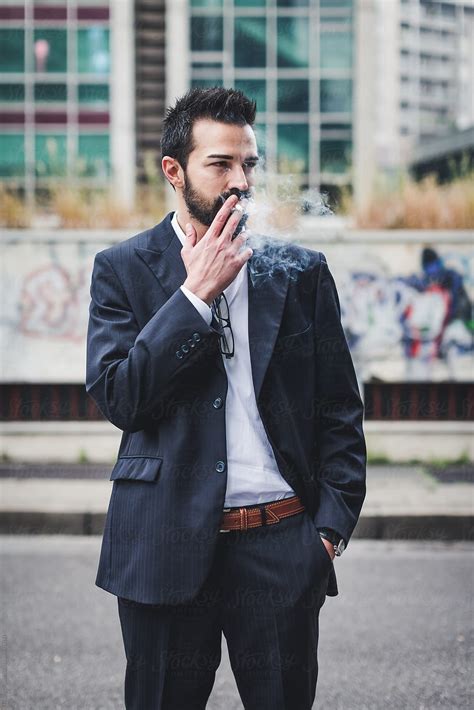 Businessman Smoking A Cigarette After A Stressful Business Day By